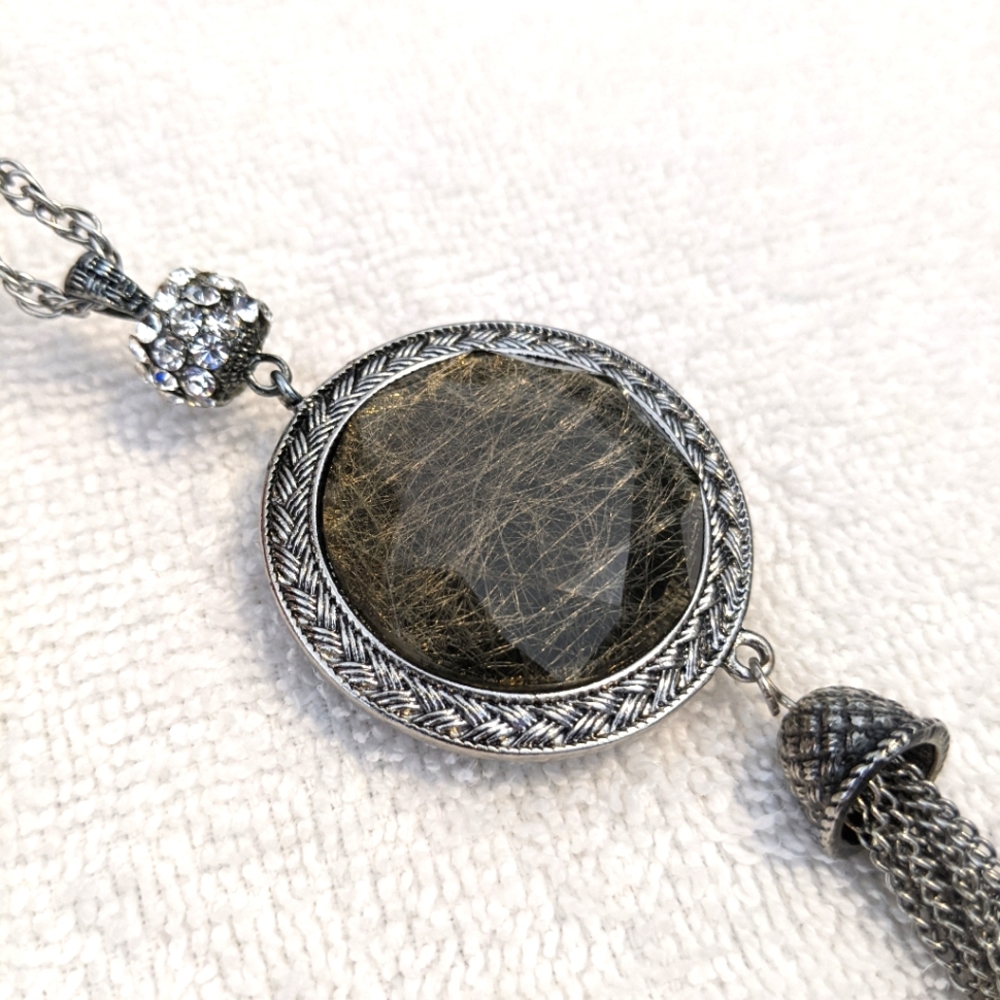 Long Olsen necklace with a pretty double sided pendant